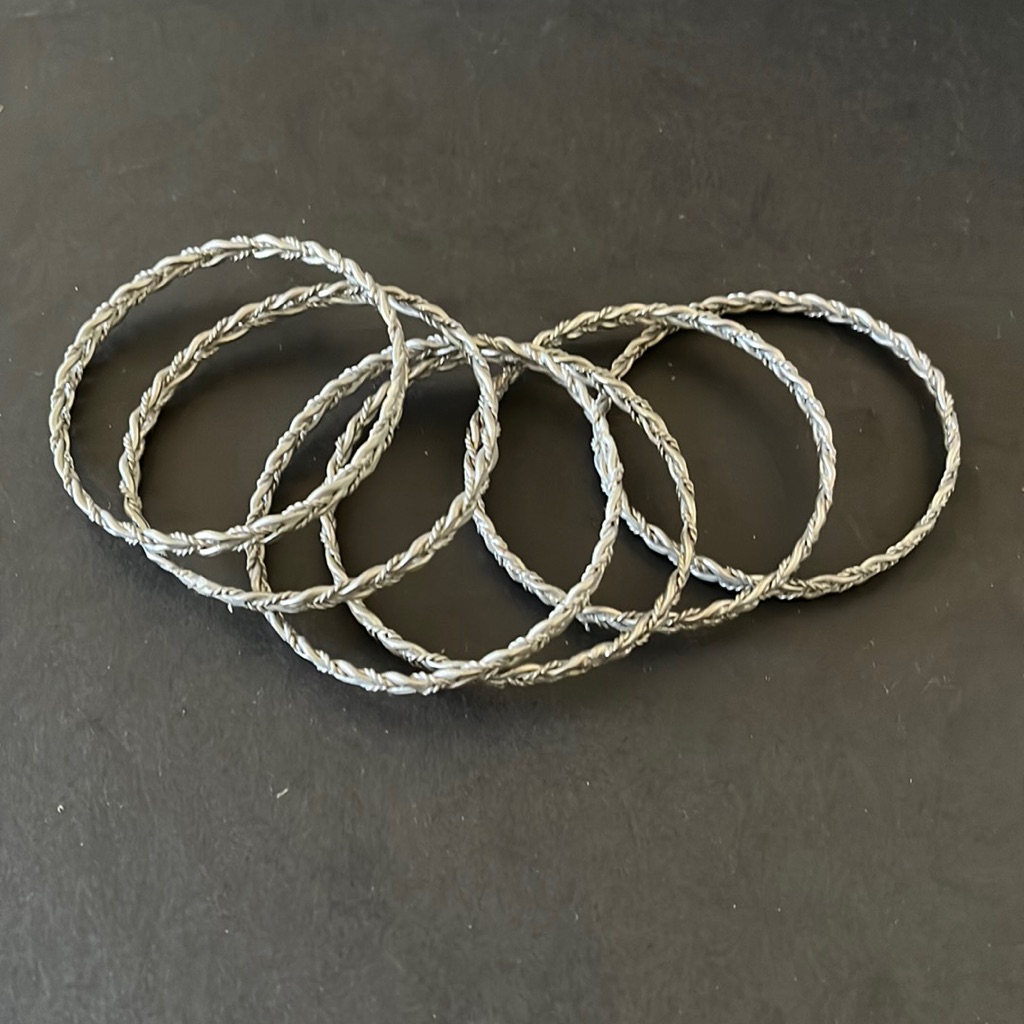 6 Silver Bangles.